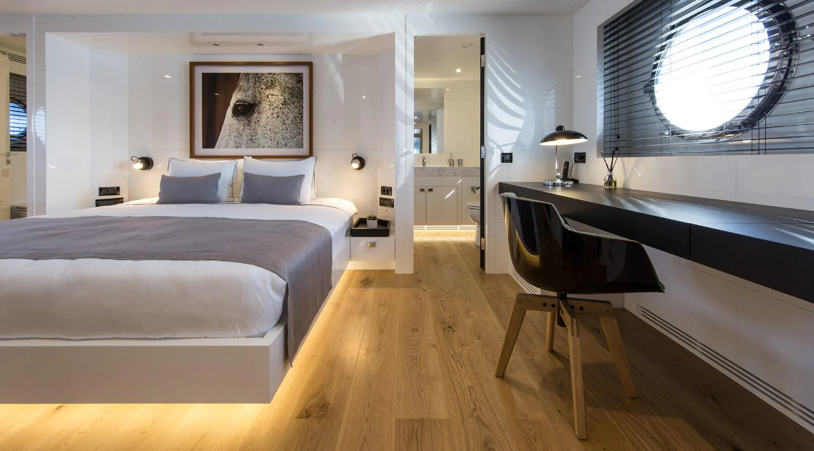 a room with a bed and a desk aboard S7 Yacht for Sale