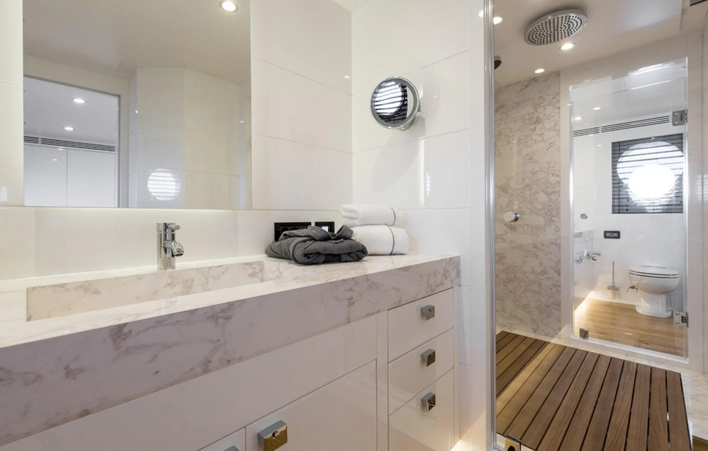 a bathroom with a large mirror aboard S7 Yacht for Sale