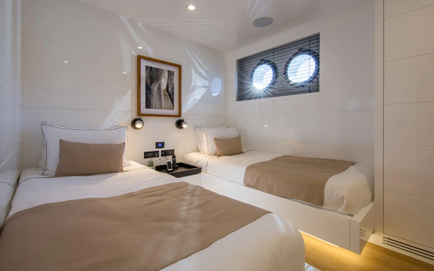 a room with two beds aboard S7 Yacht for Sale