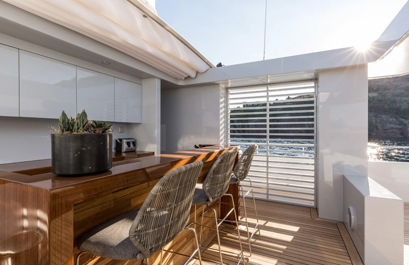 a modern looking kitchen with a large open window aboard S7 Yacht for Sale