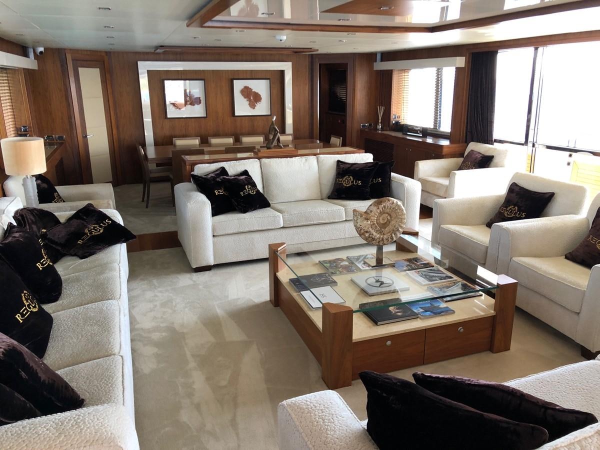 a living room with white couches aboard REGULUS Yacht for Sale