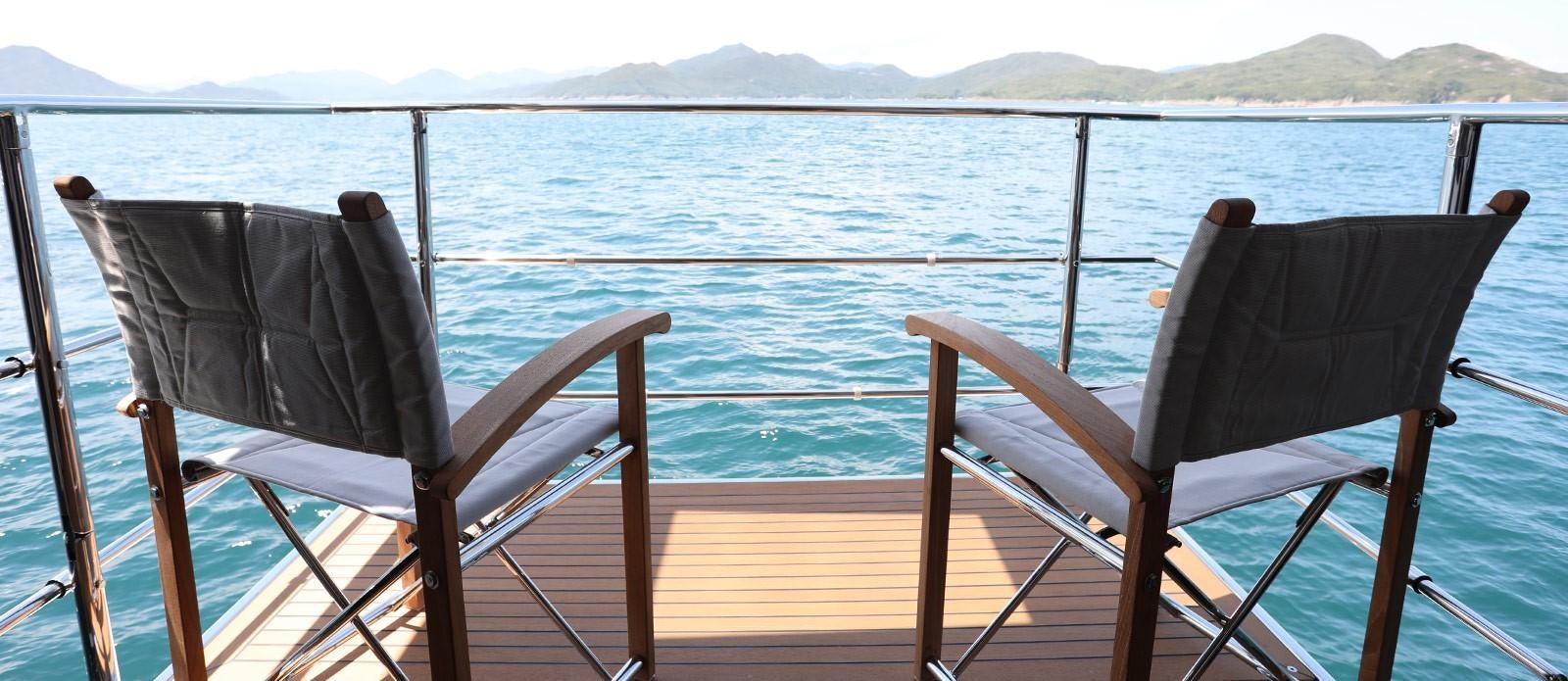 chairs on a deck aboard J & LI Yacht for Sale