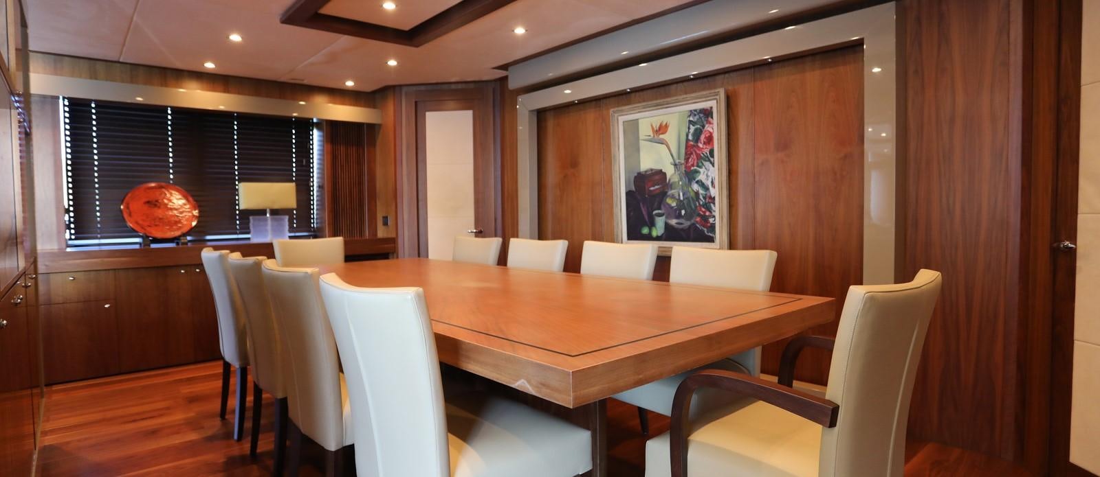 a room with a table and chairs aboard J & LI Yacht for Sale