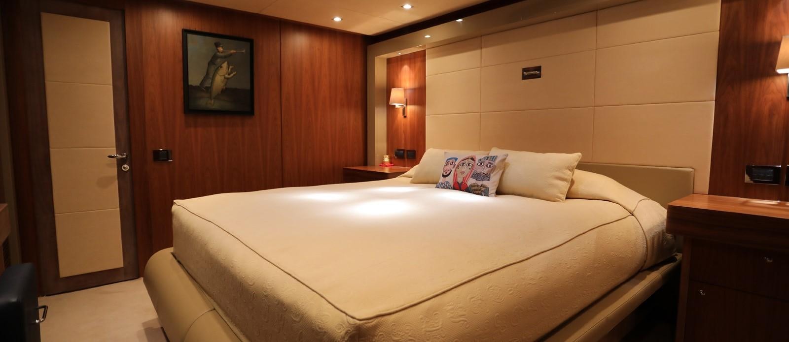 a bed in a room aboard J & LI Yacht for Sale