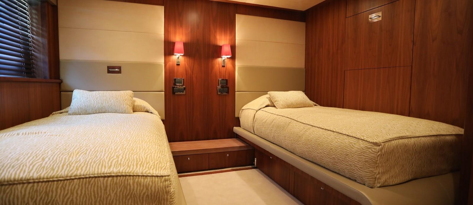 a room with two beds aboard J & LI Yacht for Sale
