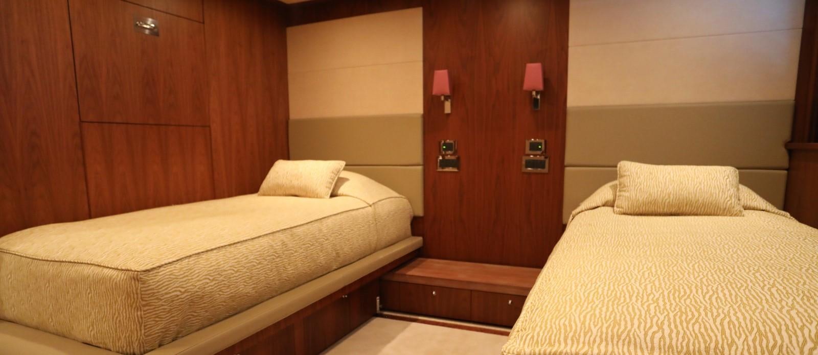 a room with two beds aboard J & LI Yacht for Sale