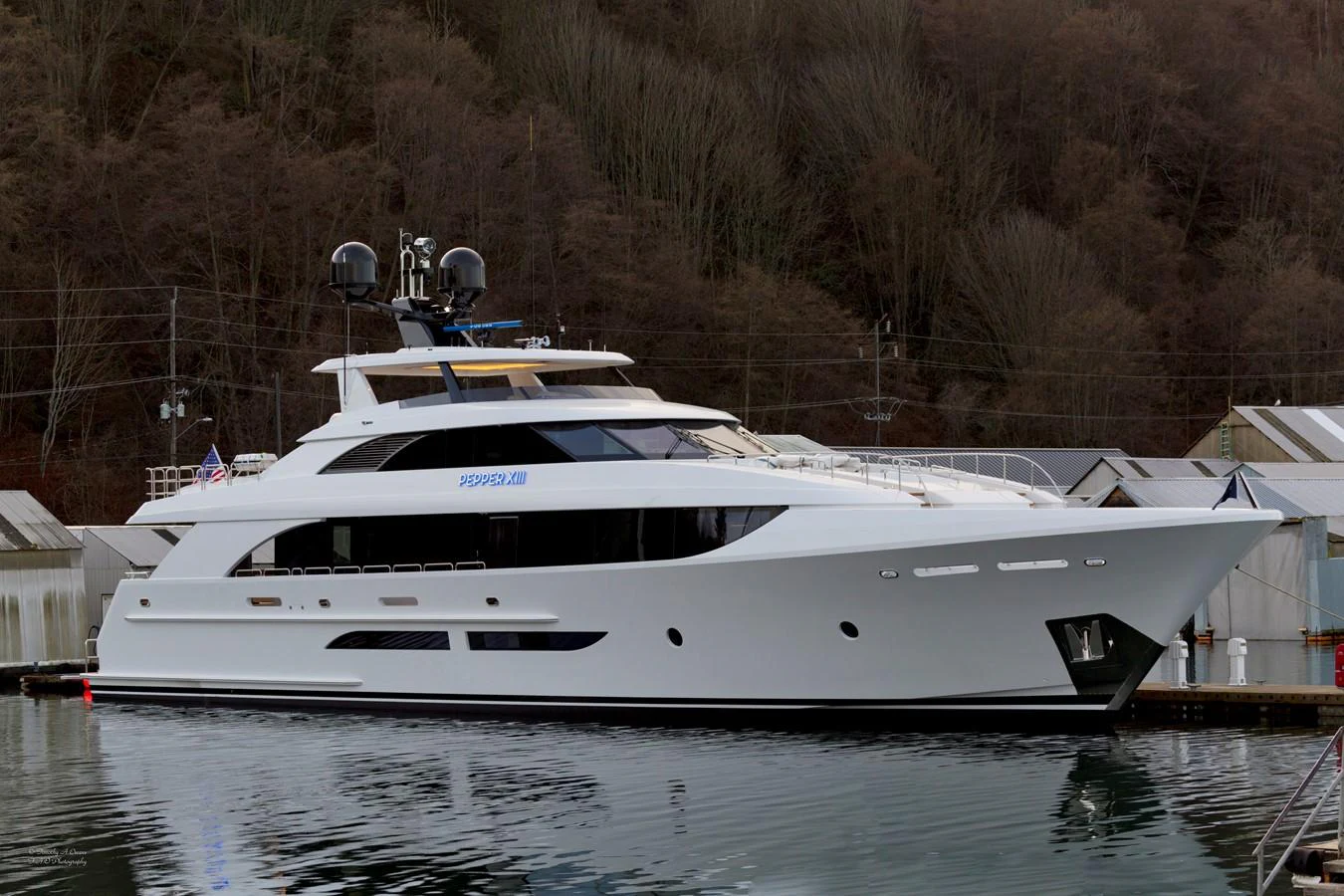 a white yacht docked aboard PEPPER XIII Yacht for Sale