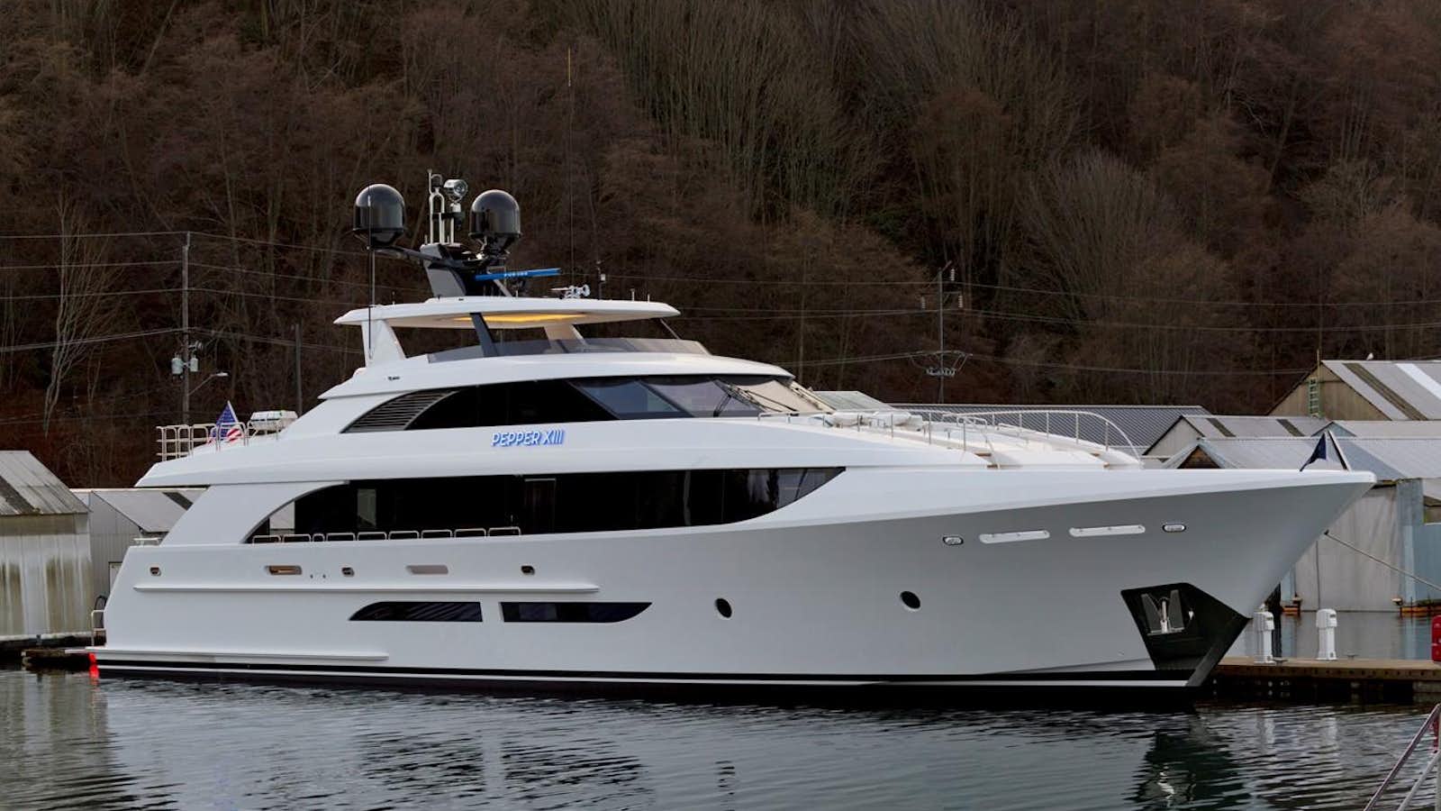 a white yacht docked aboard PEPPER XIII Yacht for Sale
