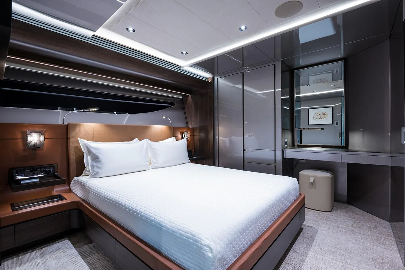 a room with a bed and a desk aboard PEPPER XIII Yacht for Sale
