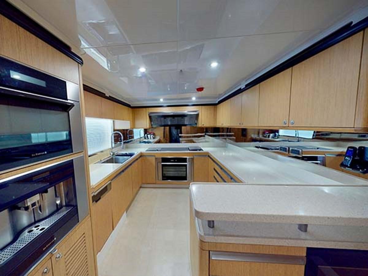 a kitchen with a large oven aboard AL WASMY I Yacht for Sale