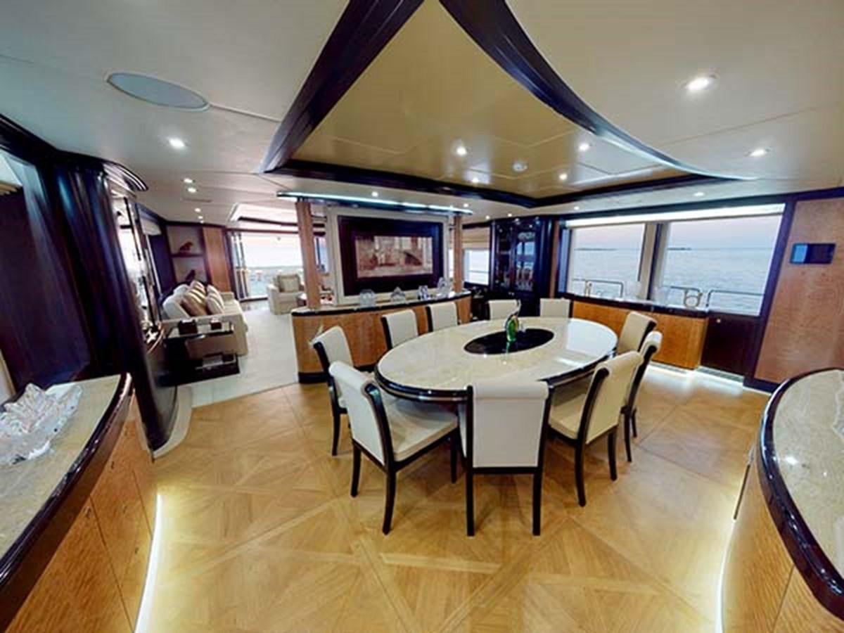 a dining room with a table and chairs aboard AL WASMY I Yacht for Sale