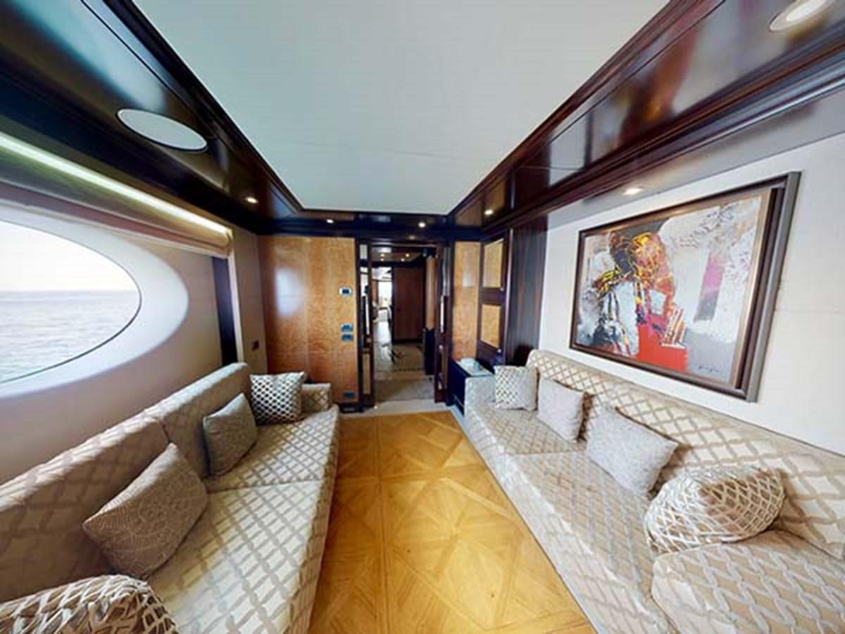 a large living room with a large painting on the wall aboard AL WASMY I Yacht for Sale