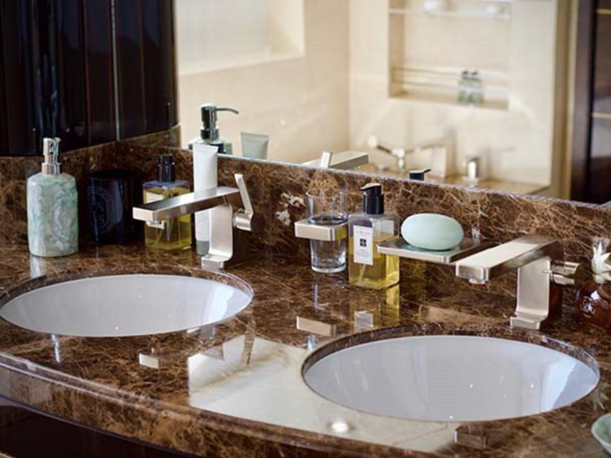 a bathroom with a sink and a mirror aboard AL WASMY I Yacht for Sale