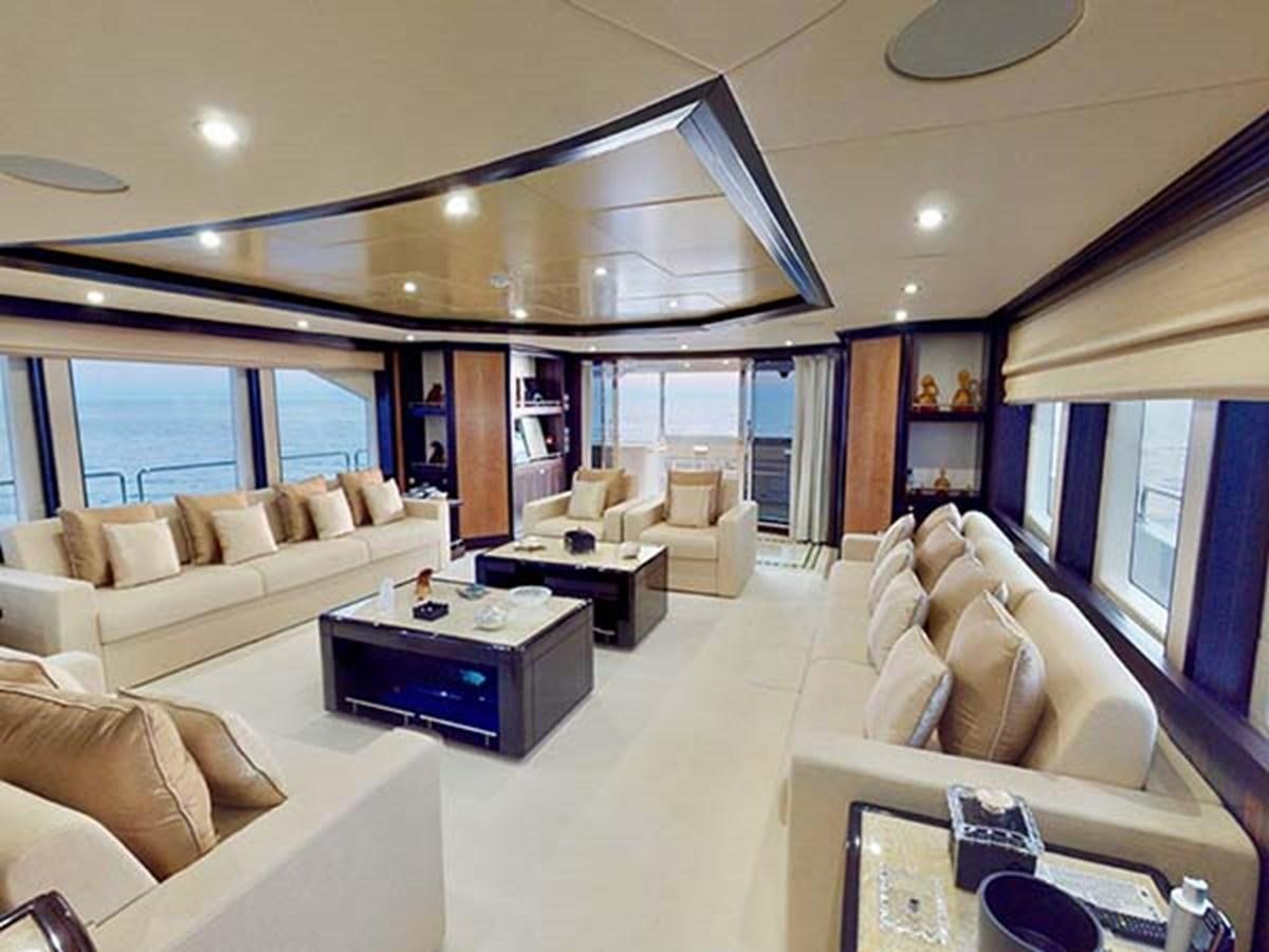 a living room with a large window aboard AL WASMY I Yacht for Sale