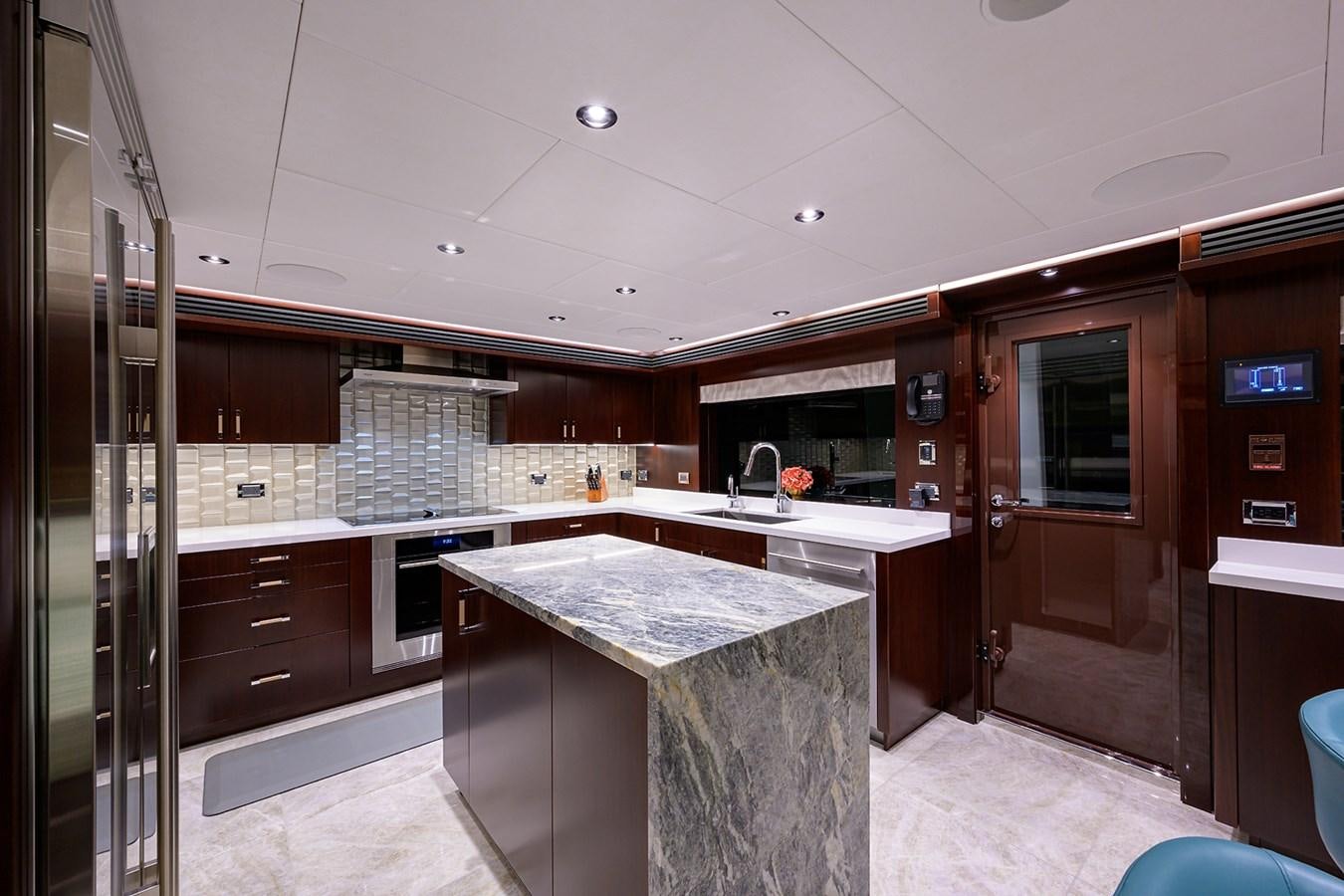 a kitchen with a large island aboard MARSHA KAY Yacht for Sale