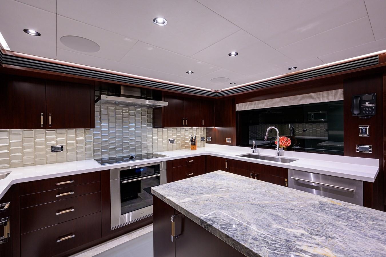 a kitchen with a large island aboard MARSHA KAY Yacht for Sale