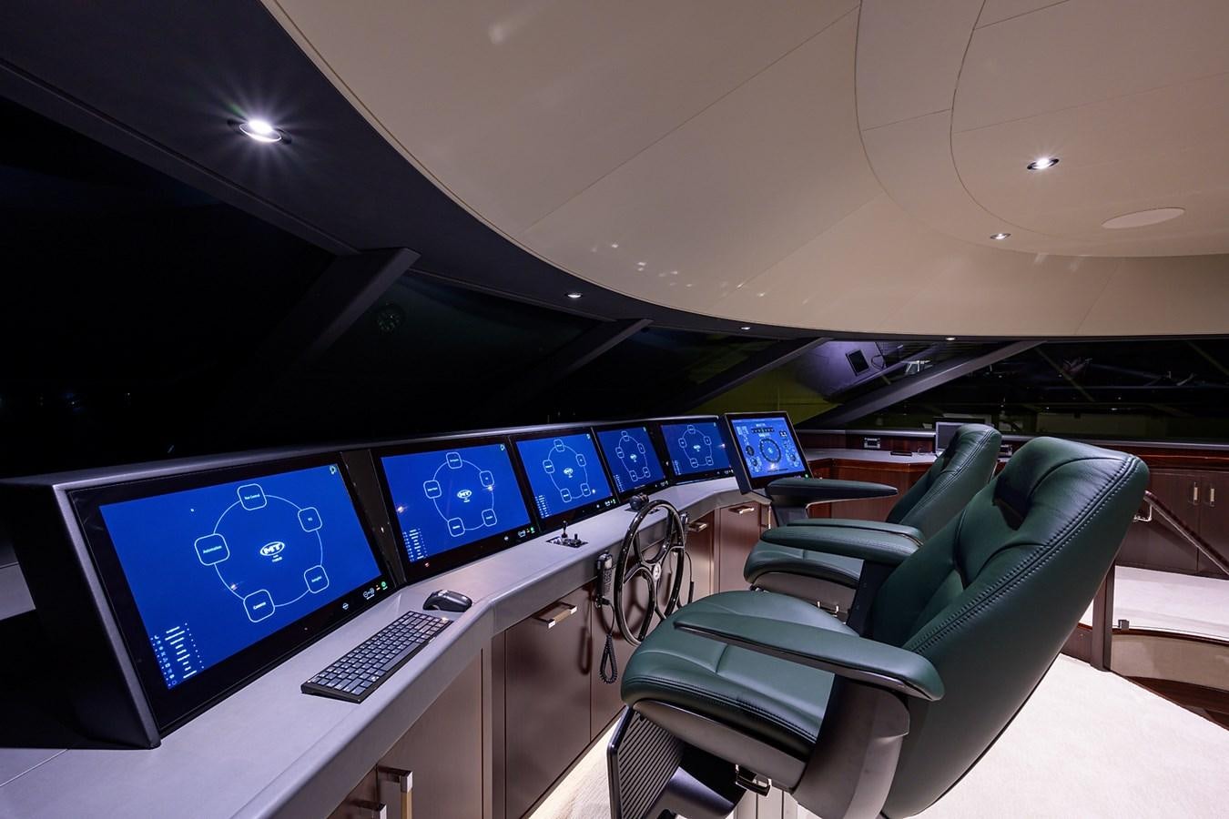 a room with a row of computers aboard MARSHA KAY Yacht for Sale