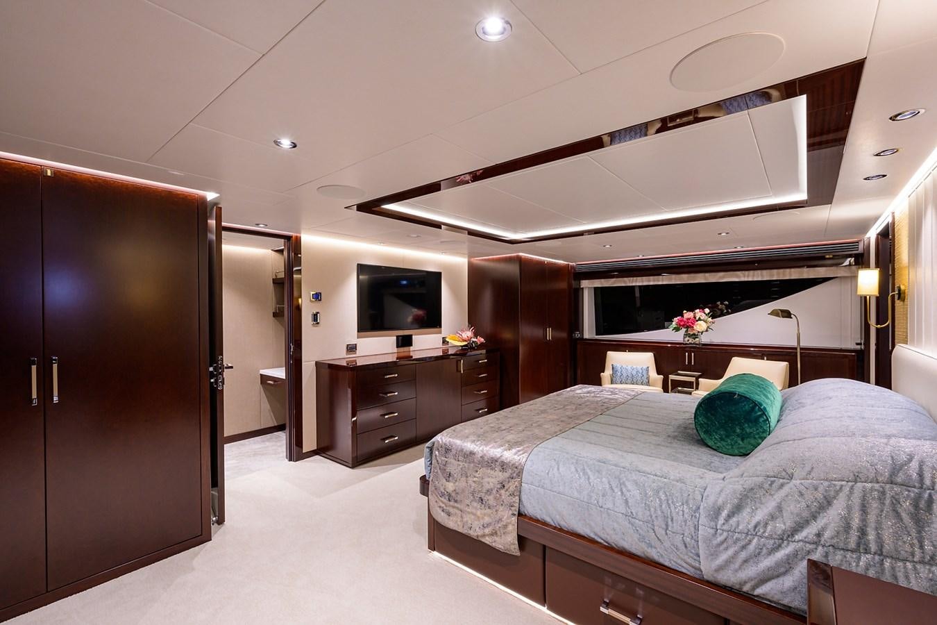 a bedroom with a bed and a television aboard MARSHA KAY Yacht for Sale