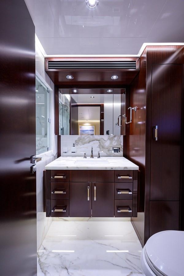 a bathroom with a sink and a mirror aboard MARSHA KAY Yacht for Sale
