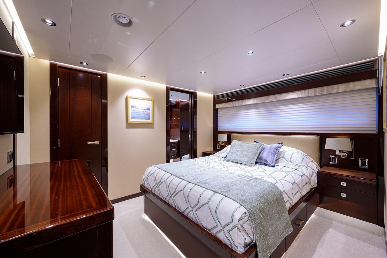 a bedroom with a bed and a desk aboard MARSHA KAY Yacht for Sale