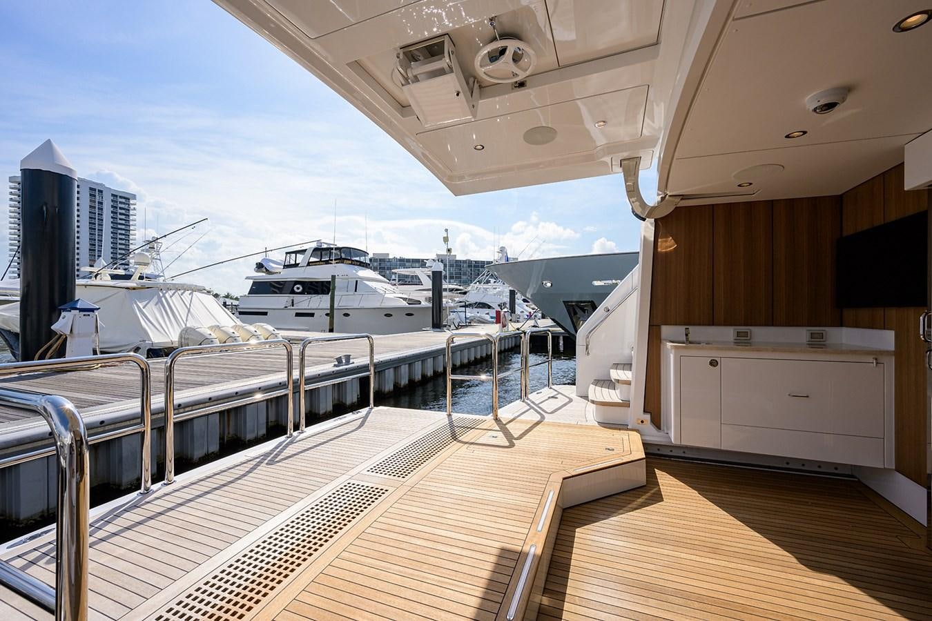 a deck with a deck and a large ship in the water aboard MARSHA KAY Yacht for Sale