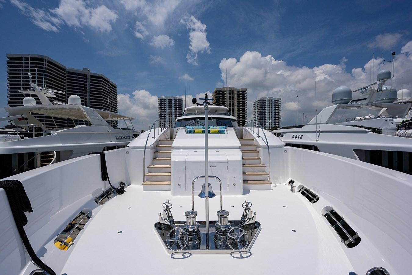 a large white ship with a bicycle rack and a cart on it aboard MARSHA KAY Yacht for Sale