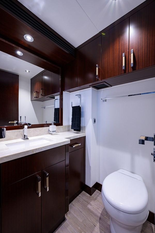 a bathroom with a toilet and a sink aboard MARSHA KAY Yacht for Sale