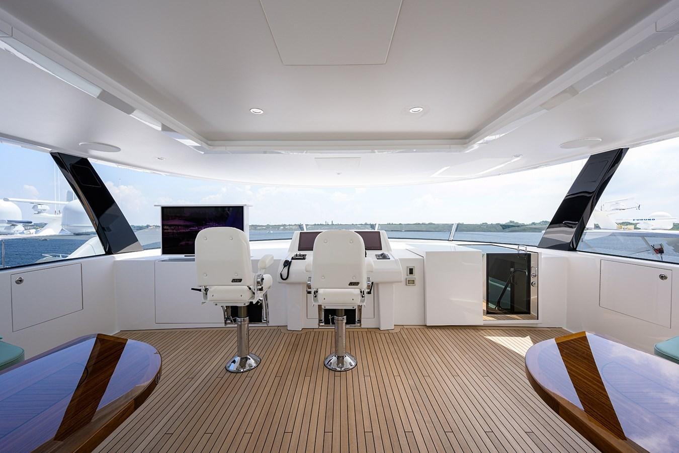 a room with a table chairs and a window aboard MARSHA KAY Yacht for Sale