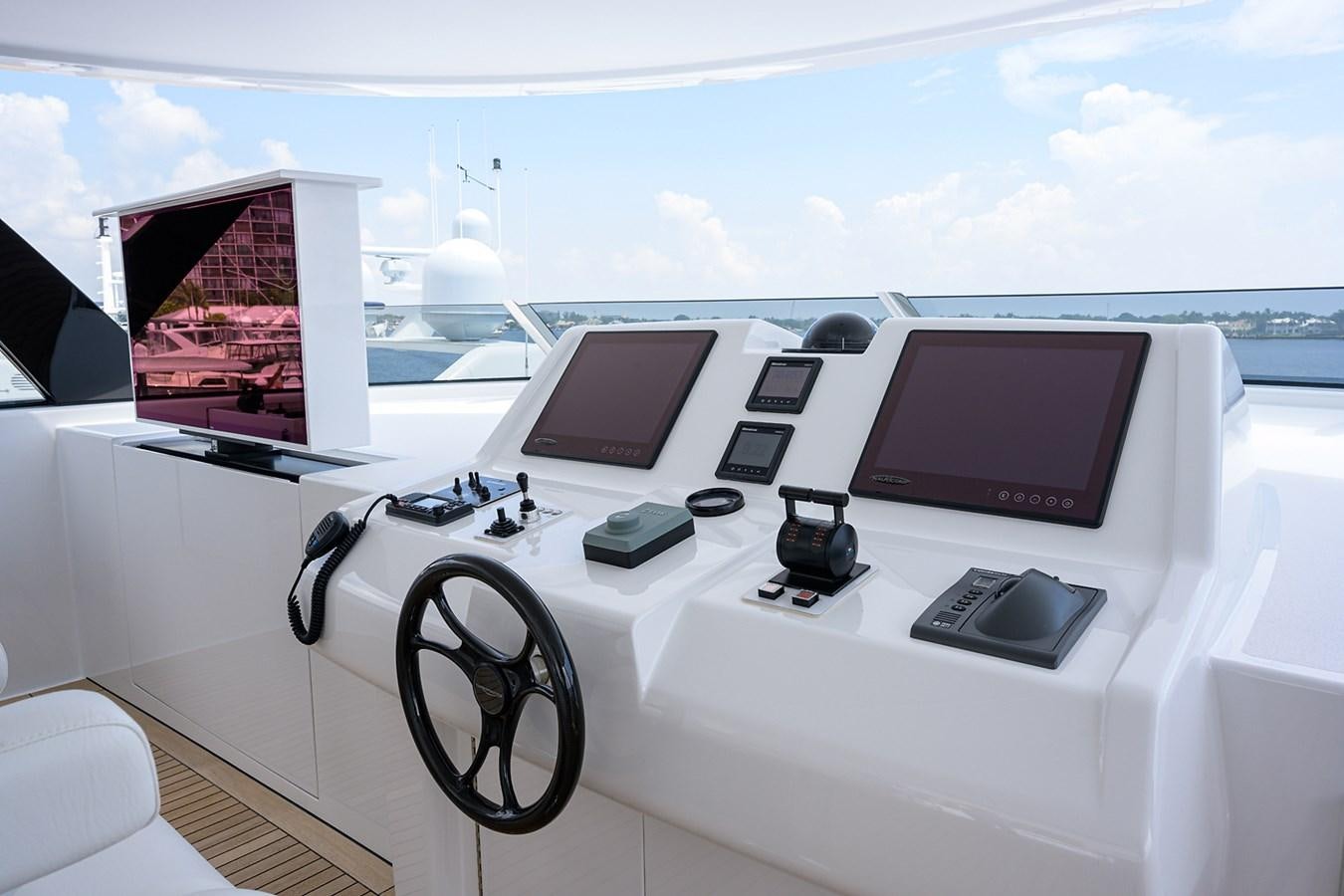a white table with a laptop and headphones on it aboard MARSHA KAY Yacht for Sale