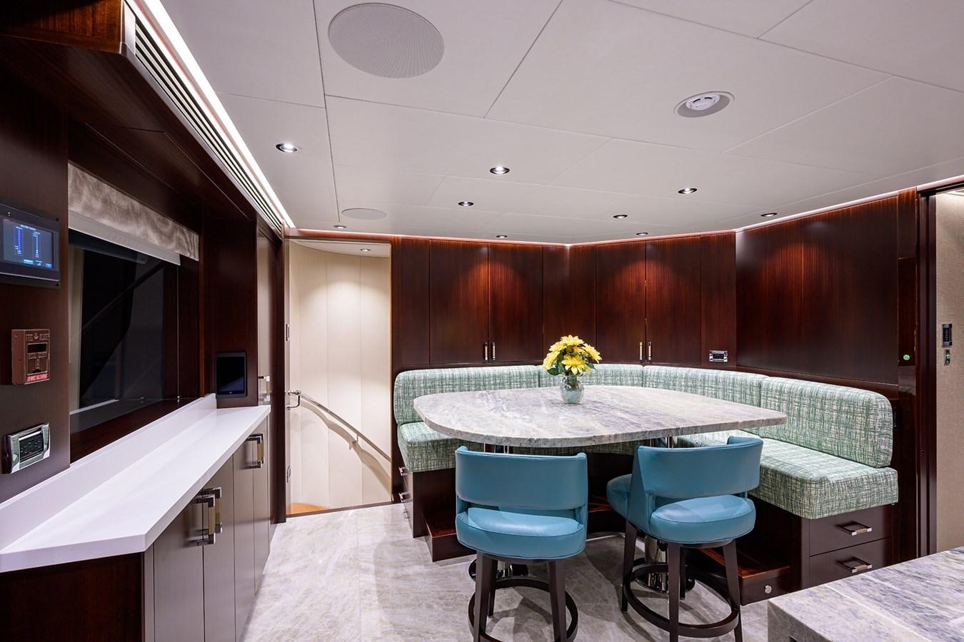 a room with a table and chairs aboard MARSHA KAY Yacht for Sale