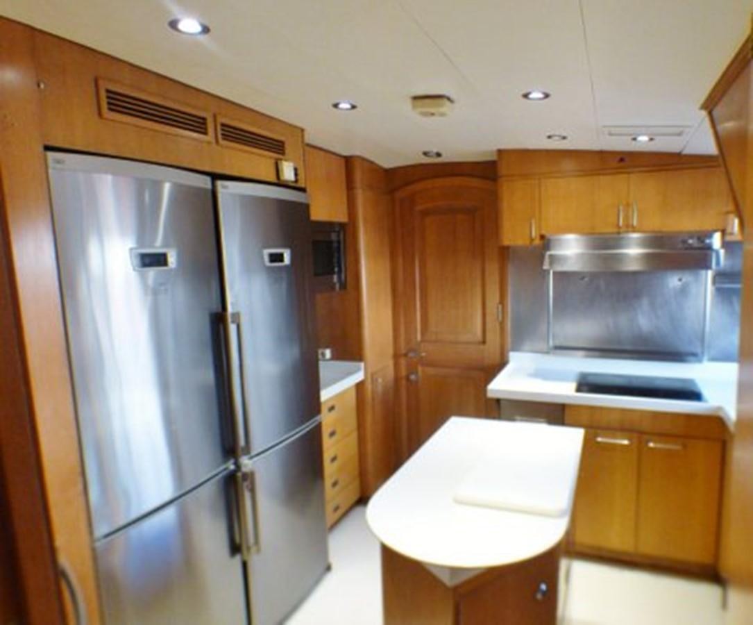 a kitchen with a refrigerator and a sink aboard ALTHEA Yacht for Sale