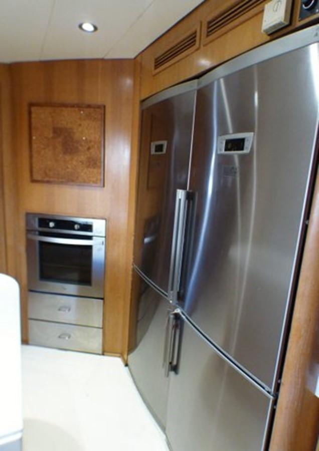 a kitchen with stainless steel appliances aboard ALTHEA Yacht for Sale