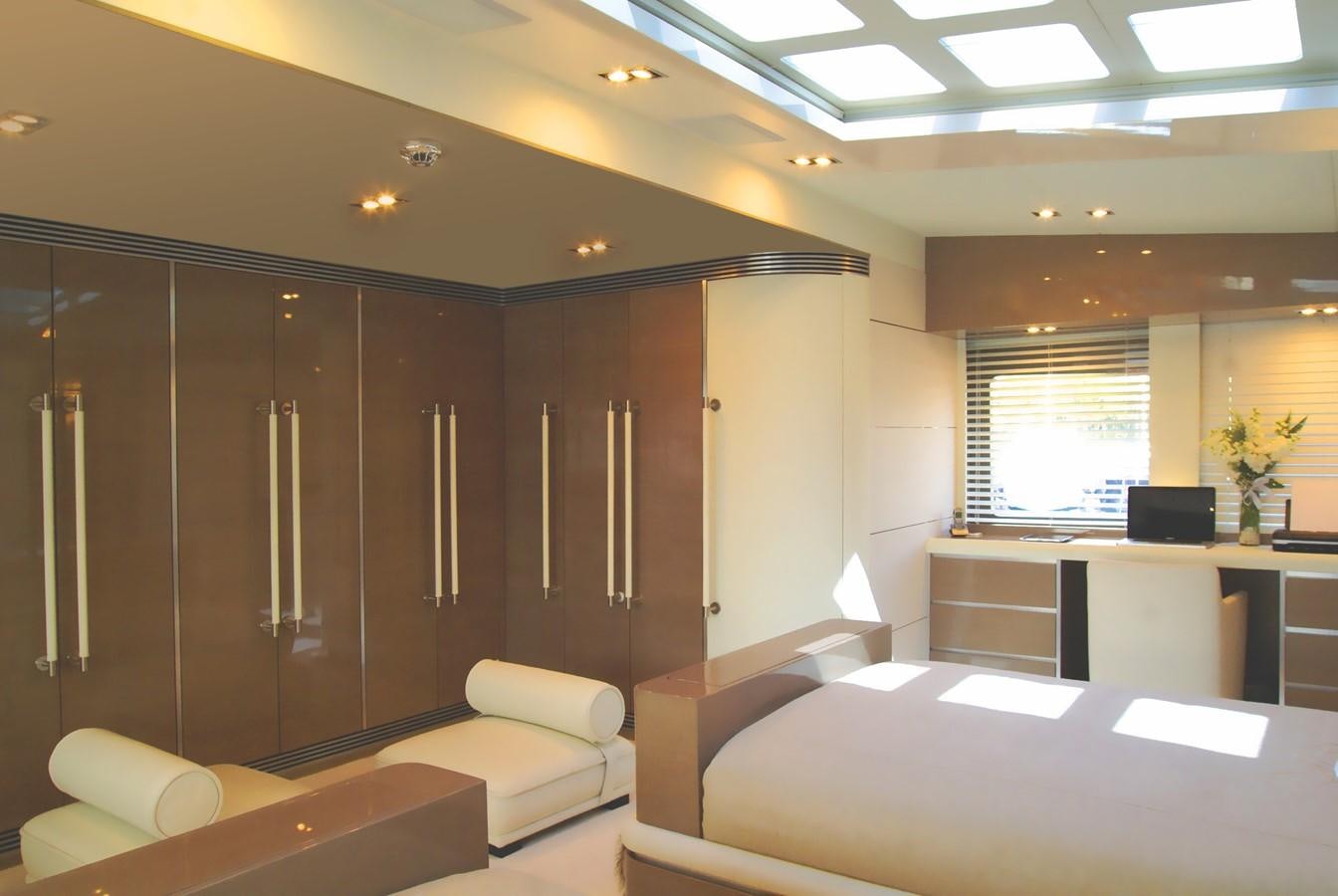 a room with a bed and a desk aboard RL NOOR Yacht for Sale