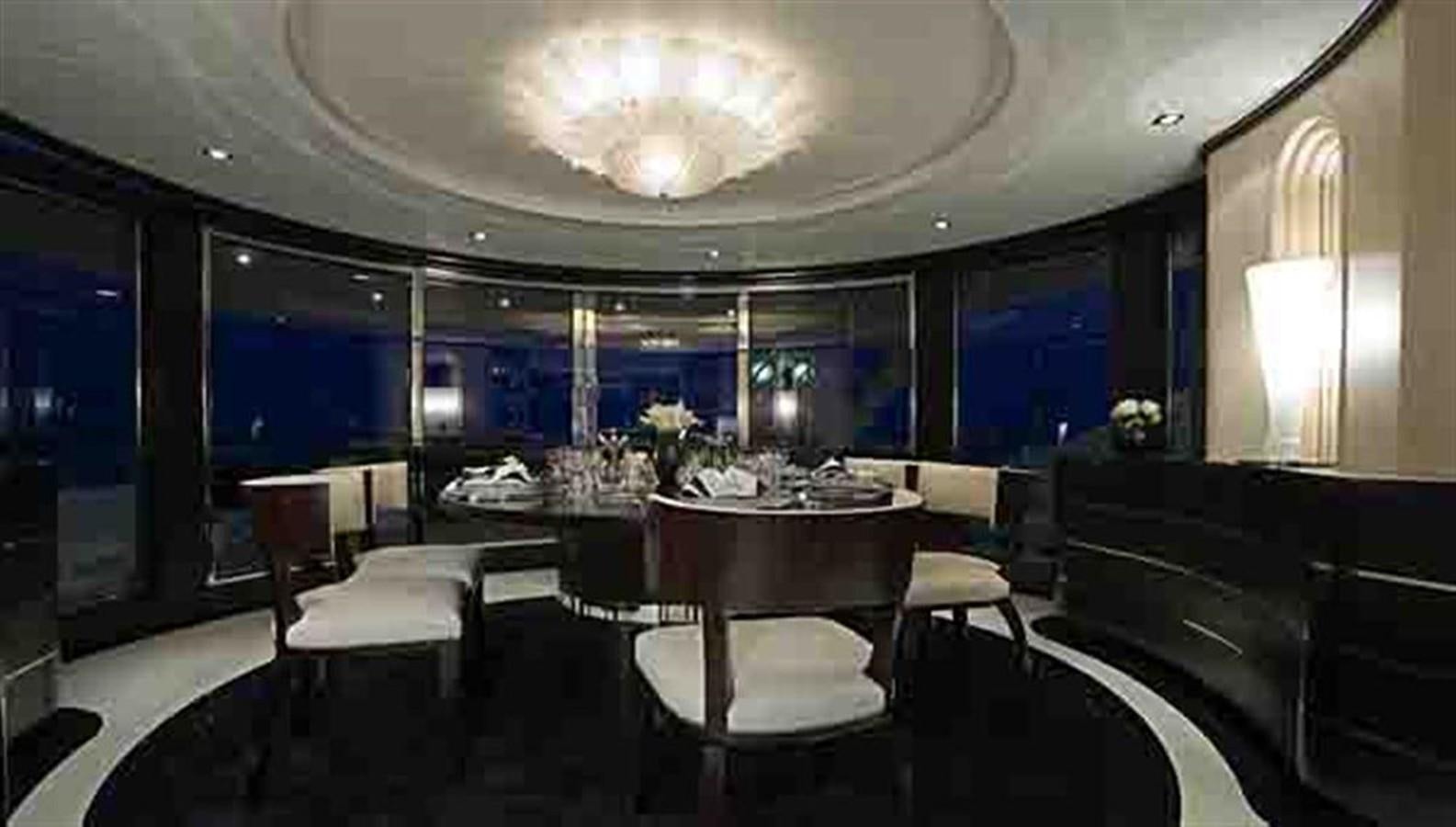 a room with tables and chairs aboard G-FORCE Yacht for Charter