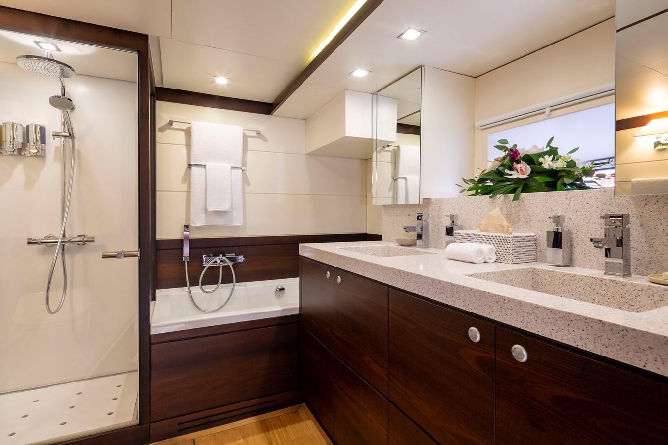 a bathroom with a sink and a shower aboard RADIANCE Yacht for Sale
