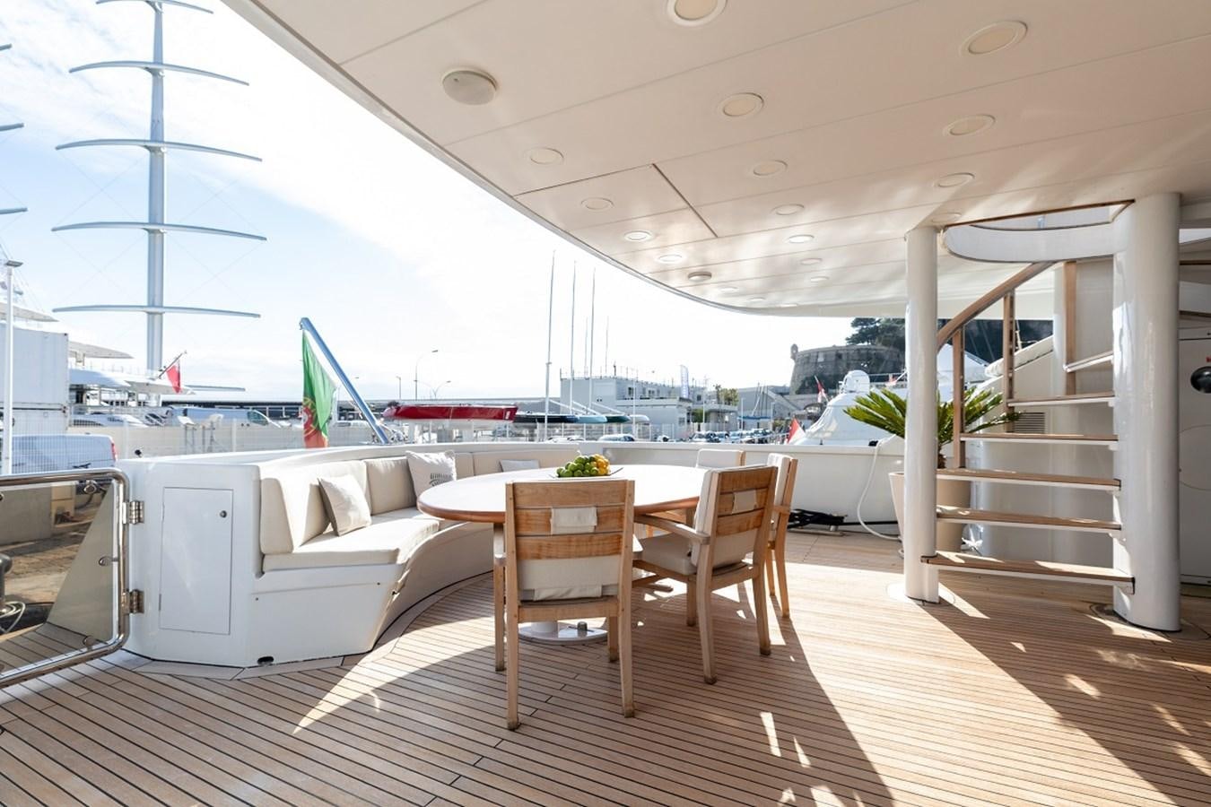 a room with a table and chairs aboard PALM B Yacht for Sale