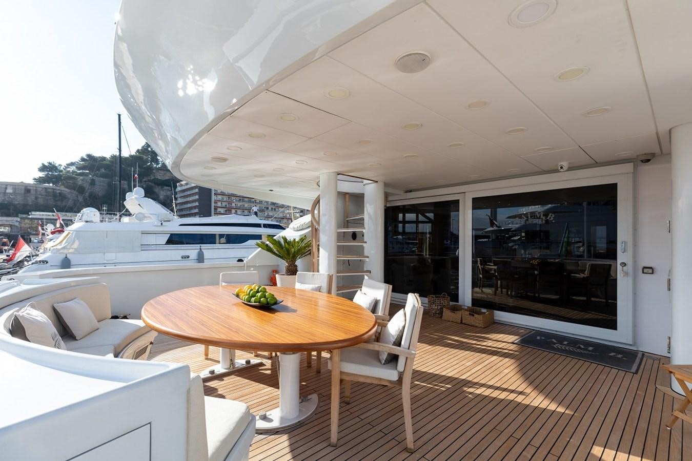 a room with a table and chairs aboard PALM B Yacht for Sale