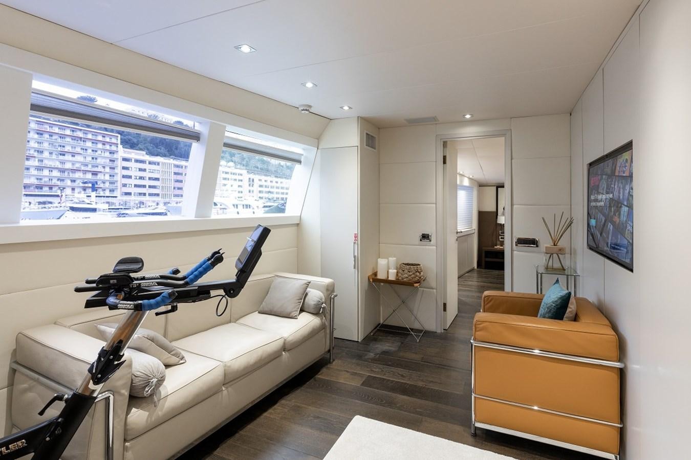 a living room with a couch and a chair aboard PALM B Yacht for Sale
