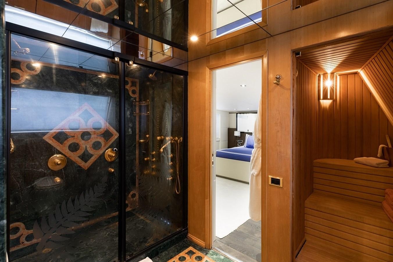 a room with a bed and a door aboard PALM B Yacht for Sale