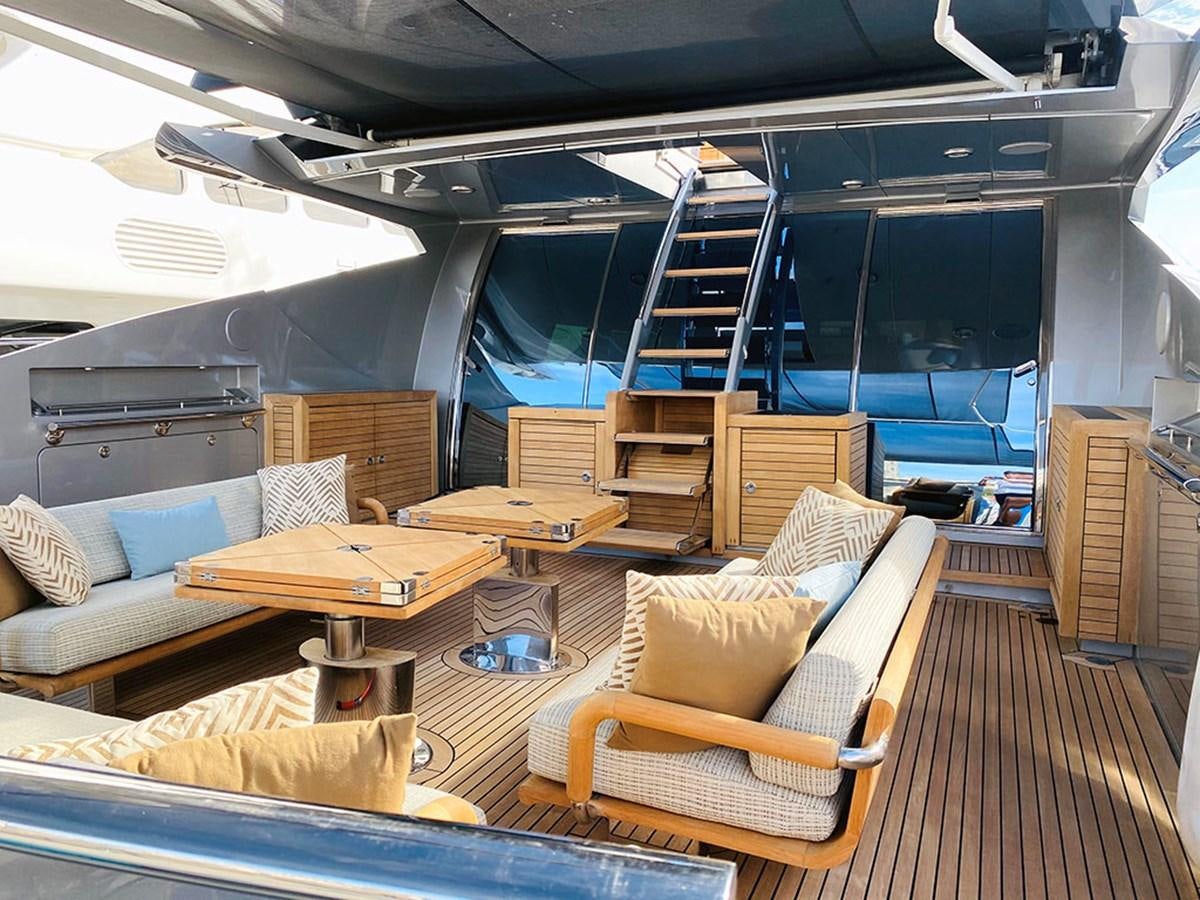 a living room with a staircase aboard ESCAPE Yacht for Sale