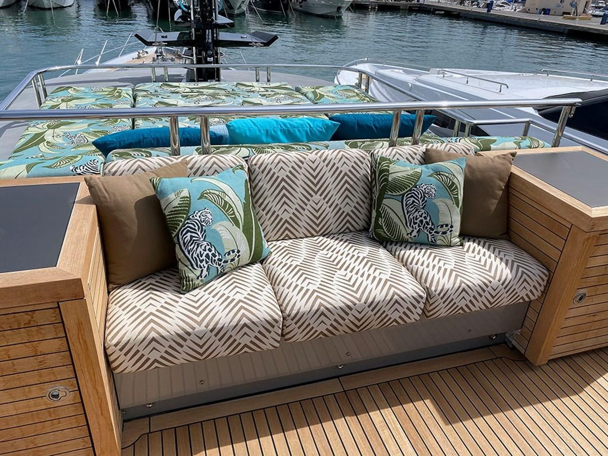 a couch on a deck aboard ESCAPE Yacht for Sale