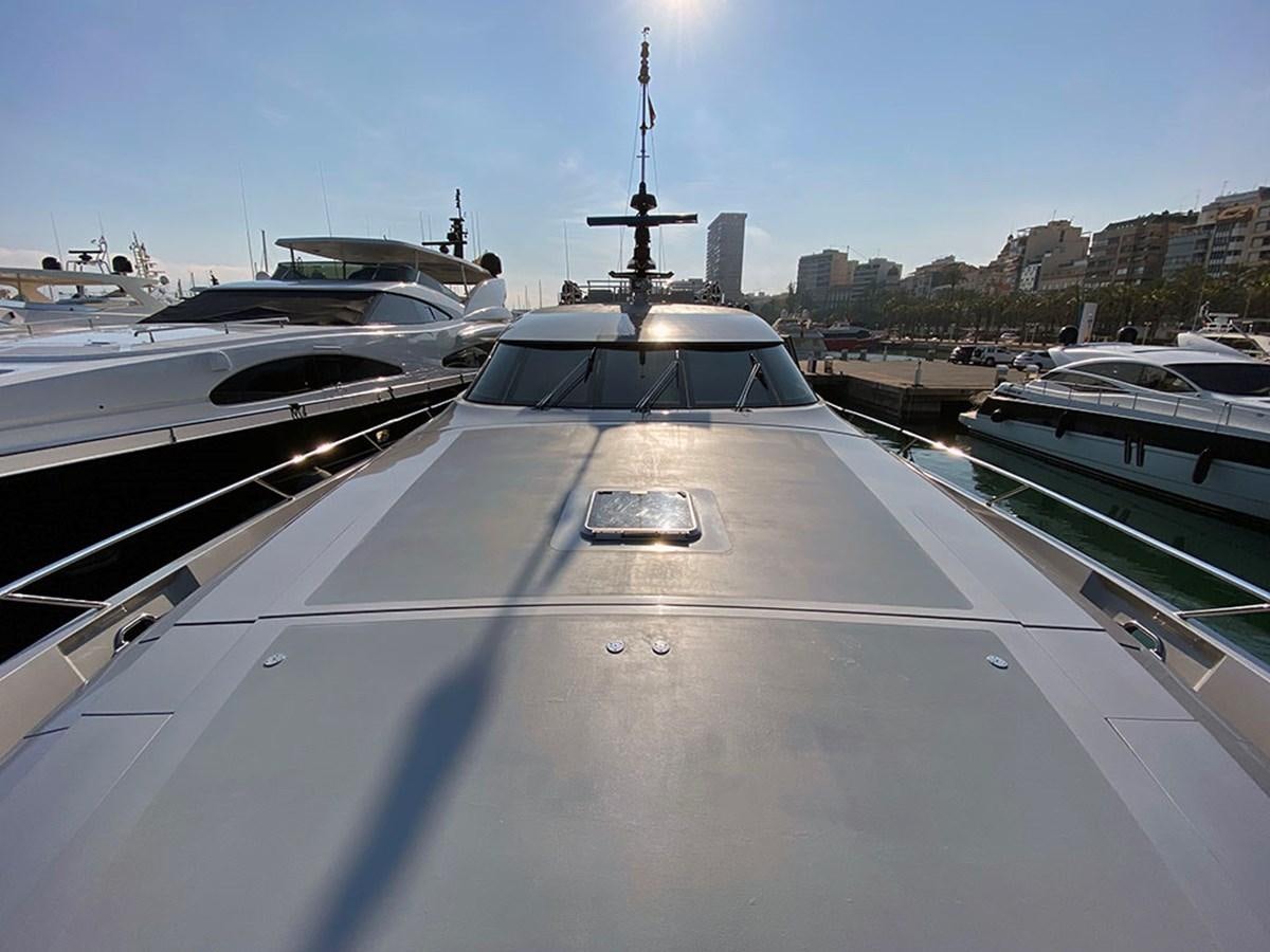 a large white boat in a harbor aboard ESCAPE Yacht for Sale