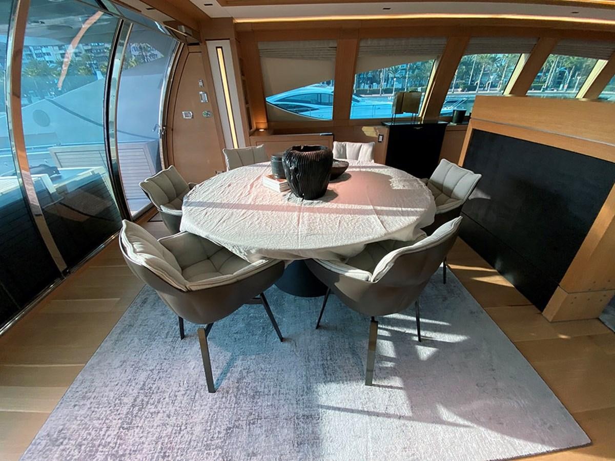 a table with chairs around it aboard ESCAPE Yacht for Sale