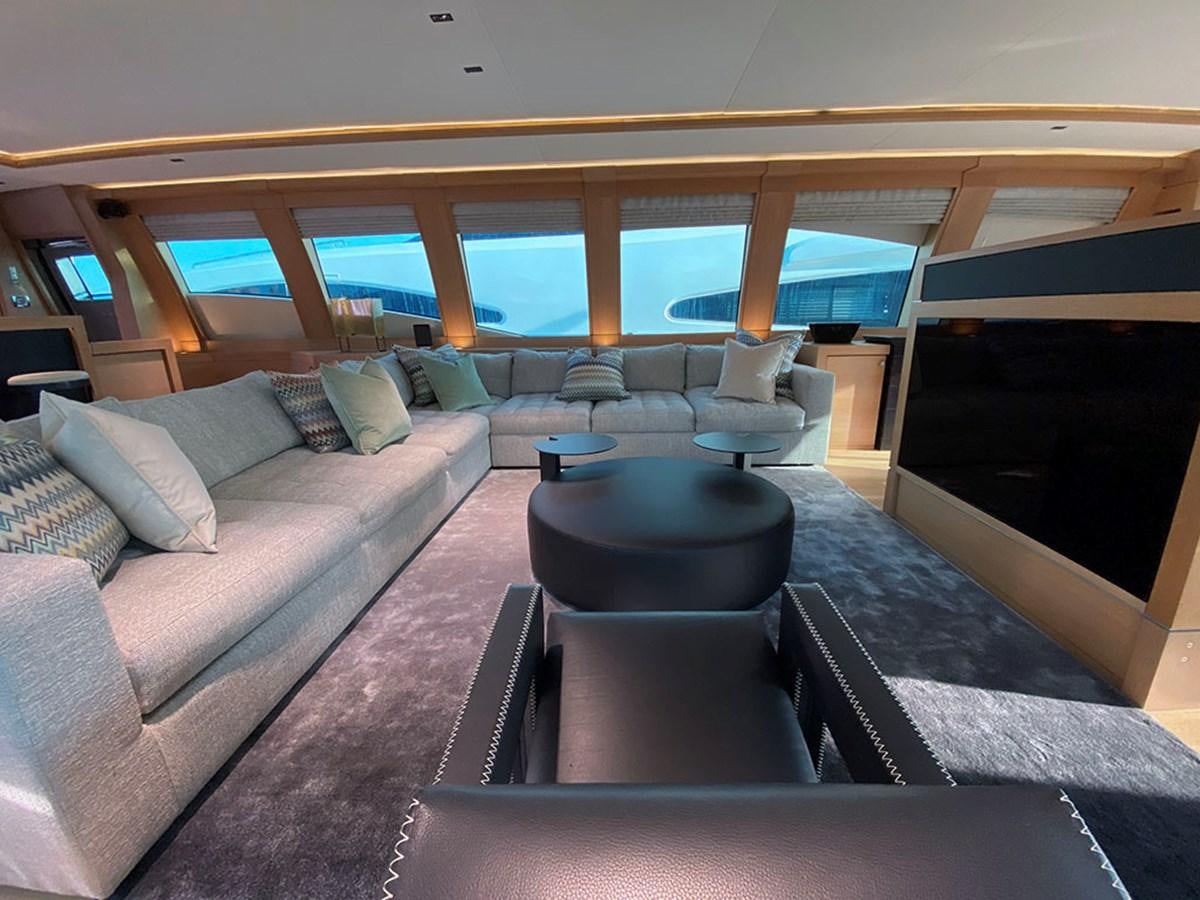 a living room with a large window aboard ESCAPE Yacht for Sale