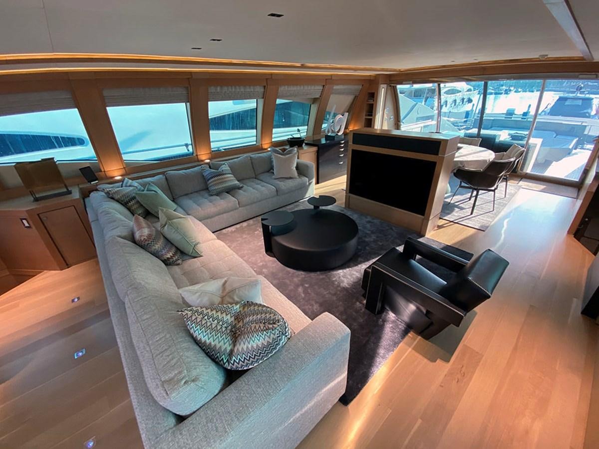 a living room with a large window aboard ESCAPE Yacht for Sale