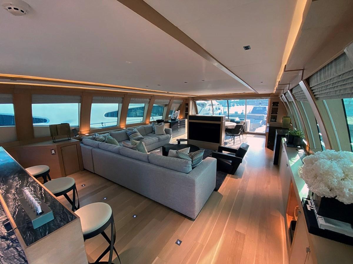 a living room with a large window aboard ESCAPE Yacht for Sale