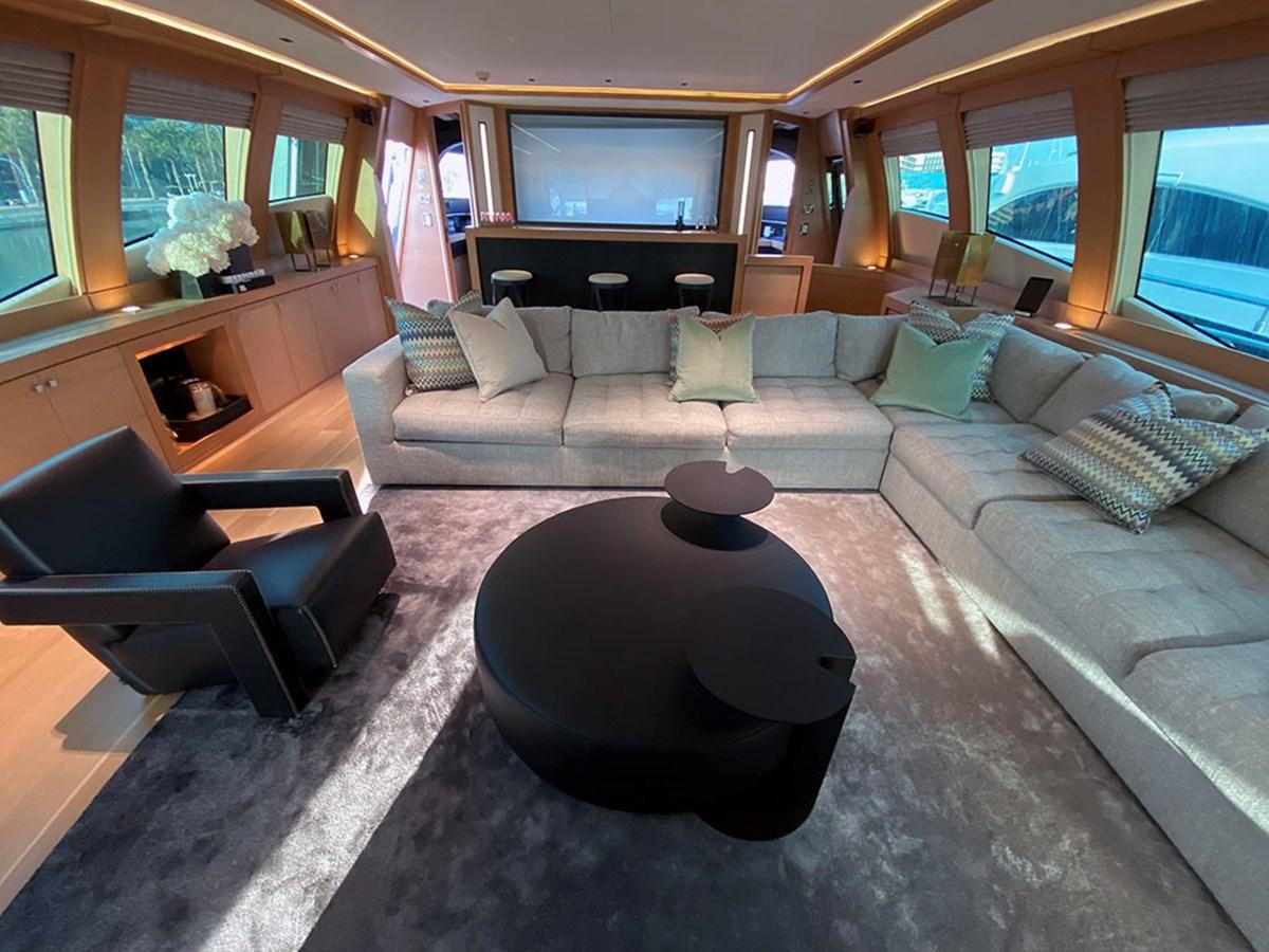 a living room with a couch and a coffee table aboard ESCAPE Yacht for Sale