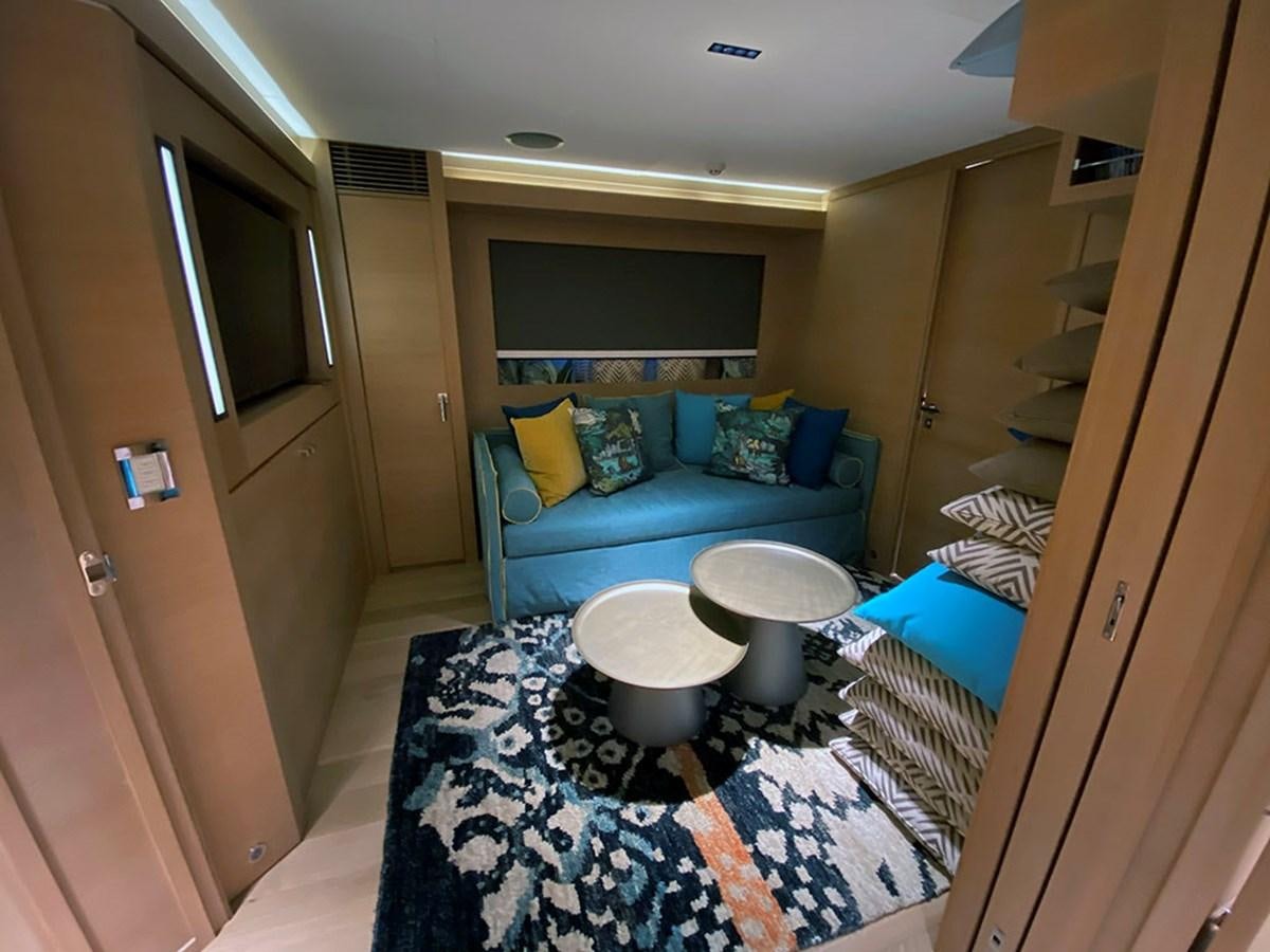 a room with a bed and a couch aboard ESCAPE Yacht for Sale