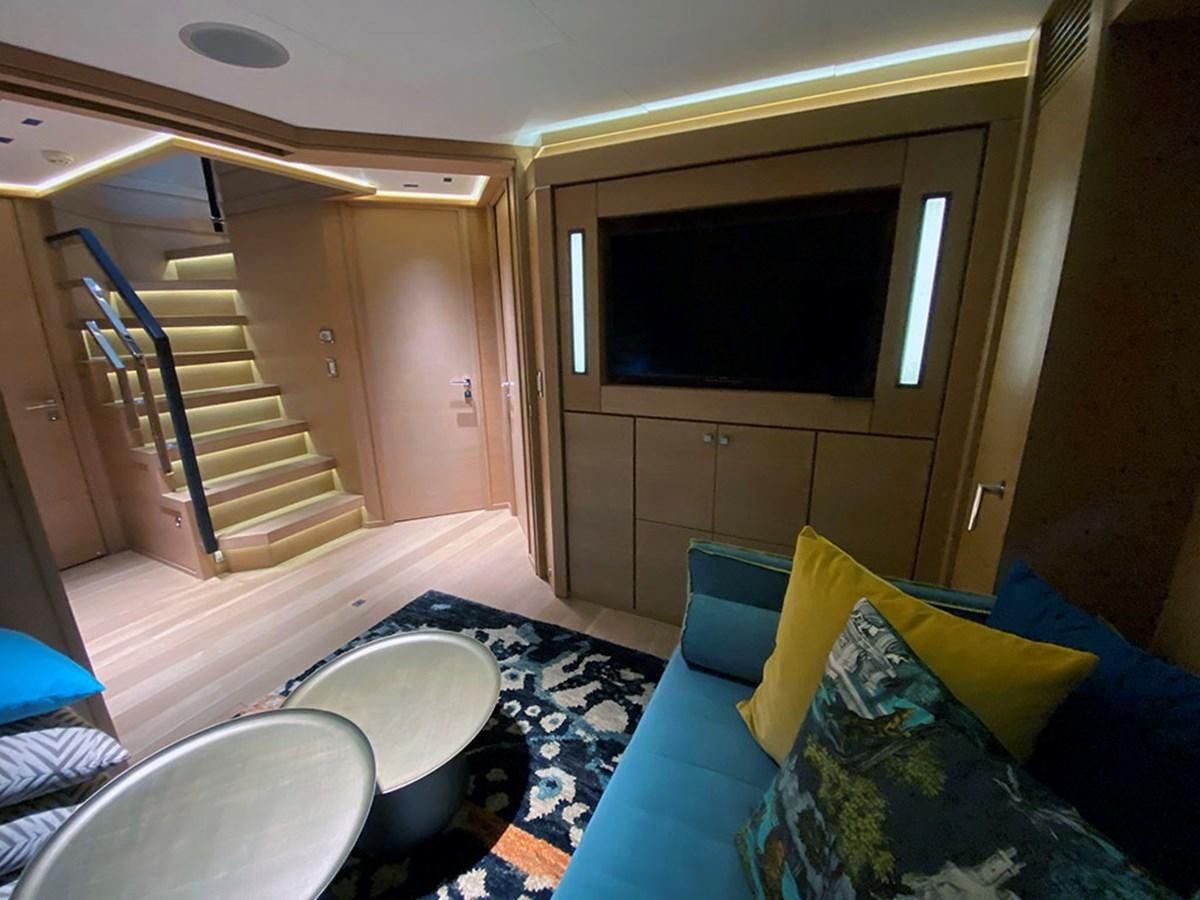 a room with a bed and a television aboard ESCAPE Yacht for Sale