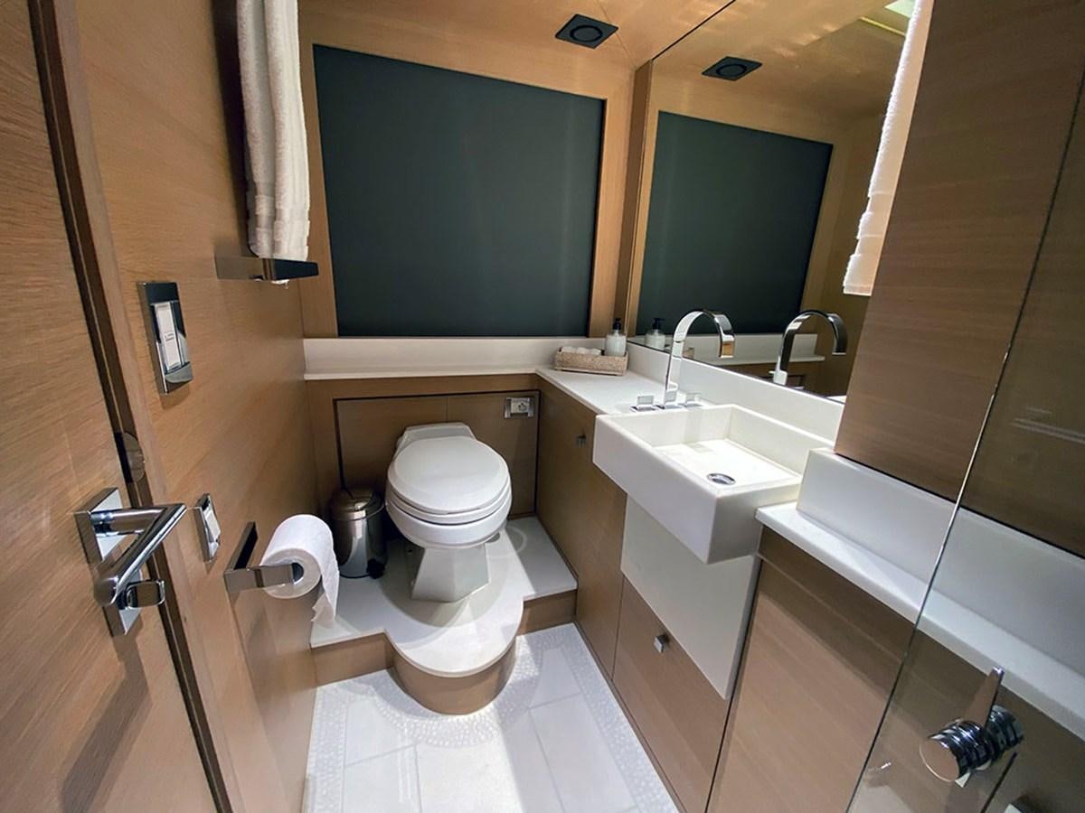 a bathroom with a toilet and sink aboard ESCAPE Yacht for Sale